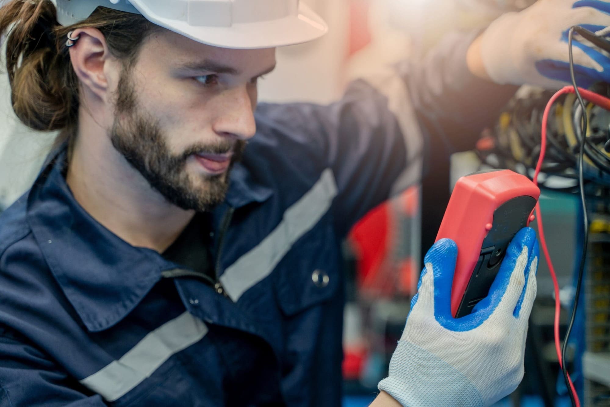 Electrical Safety: The Role of Regular Inspections and Maintenance 3 Electrician carrying out maintenance work